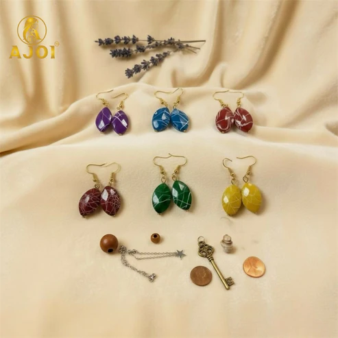 Blue marble-pattern stone drop earrings from Kati multicolor pack with gold hooks Pack of 6 multicolor marble-pattern Kati hanging earrings with gold-tone hooks Close-up of purple and green marble-pattern Kati earrings stone drop design Red and yellow marble-pattern Kati earrings showcasing artistic white streaks Blue marble-pattern stone drop earrings from Kati multicolor pack with gold hooks Multicolor marble-pattern Kati earrings hanging with lightweight gold-tone hooks Multicolor Marble-Pattern Kati Earrings – Pack of 6 Stylish Drops