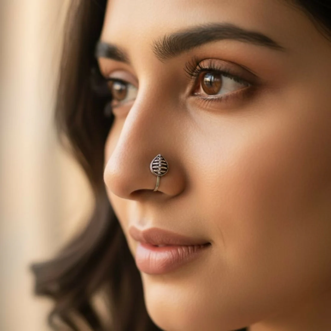 Discover the charm of our oxidized silver designer nose pins, specially crafted in a pack of 5 to enhance your ethnic beauty with elegance and style. Each nose pin features a unique design inspired by floral, geometric, and textured motifs that offer a rich antique silver finish, perfect for women and girls who appreciate minimal yet classy traditional jewelry. Made from premium quality oxidized alloy, these nose pins are lightweight, skin-friendly, and provide a comfortable fit for all-day wear. Whether for daily use, festive occasions, weddings, or gifting, these lightweight, comfortable nose pins securely grip and complement both ethnic and fusion outfits beautifully.