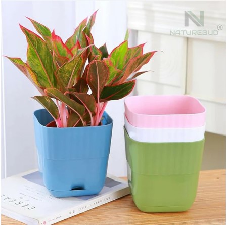 Arrangement of multi-color square flower pots showcasing space-saving shape Multi-color square flower pot set with built-in drainage holes enhancing indoor plant growth Close-up of durable plastic square flower pot from the pack of 5 Set of five multi-color lightweight plastic square flower pots for balcony gardening Square flower pots with modern design ideal for indoor and outdoor plants Arrangement of multi-color square flower pots showcasing space-saving shape Durable plastic square flower pots reusable and easy to clean in garden setting Elegant square flower pot set enhancing home and office plant decoration Square Flower Pot Set – Pack of 5 Durable Multi-Color Pots