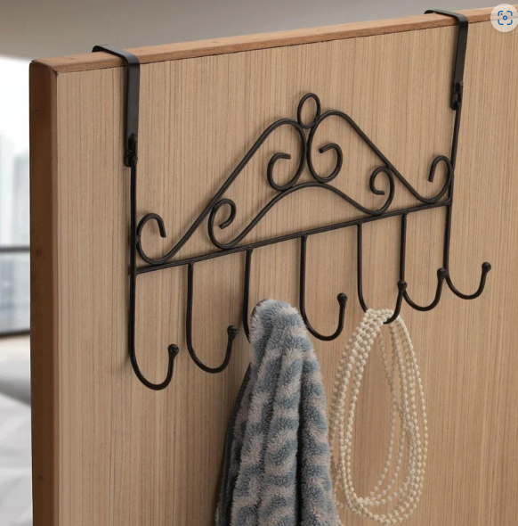 Transform your living space with our versatile Over Door Hanger Rack, designed to bring instant organisation and style to any room. Perfect for decluttering bedrooms, bathrooms, and hallways, this sturdy metal hanging rack offers a smart, space-saving storage solution without the need for drilling or complex installation. Simply hang it over any standard door and enjoy the convenience of seven robust hooks, ready to hold everything from coats and hats to bags and towels. Experience a tidier home with this elegant and functional organizer from Indo Glow.