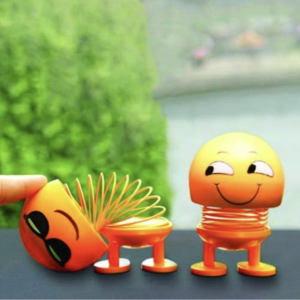 Shaking Head Doll – Smiling Emoticon Figure | Dollovia